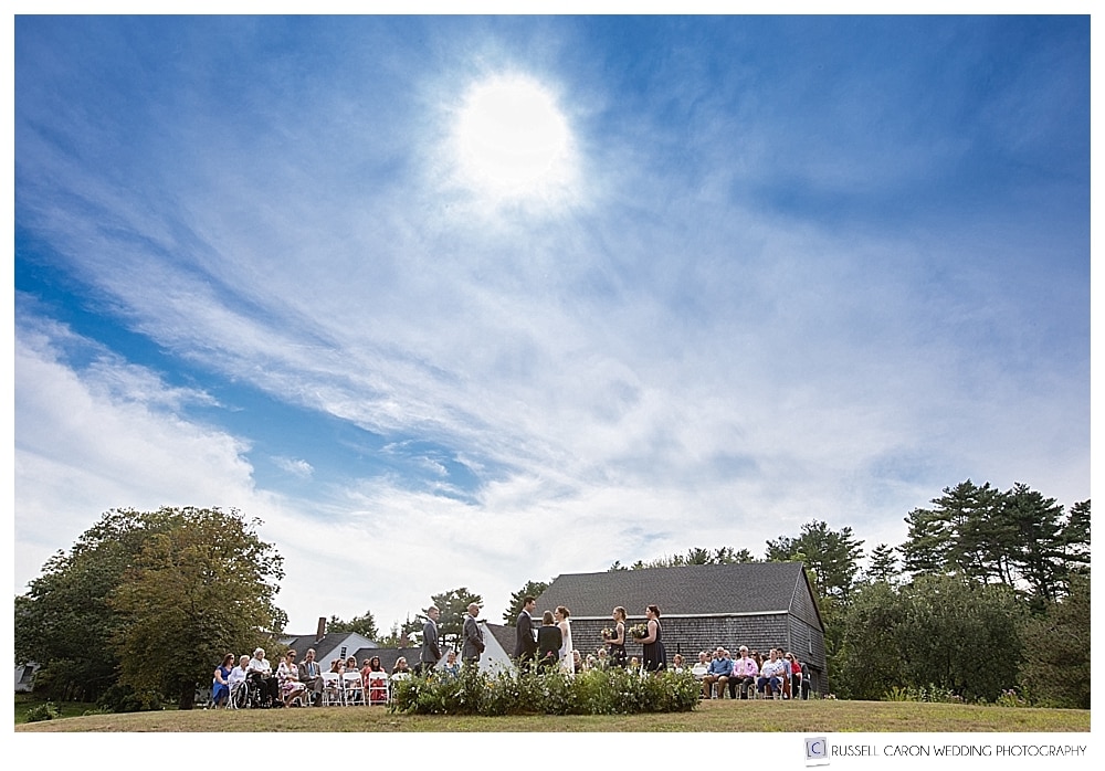outdoor wedding ceremony on the knoll at the 1774 Inn in Phippsburg, Maine