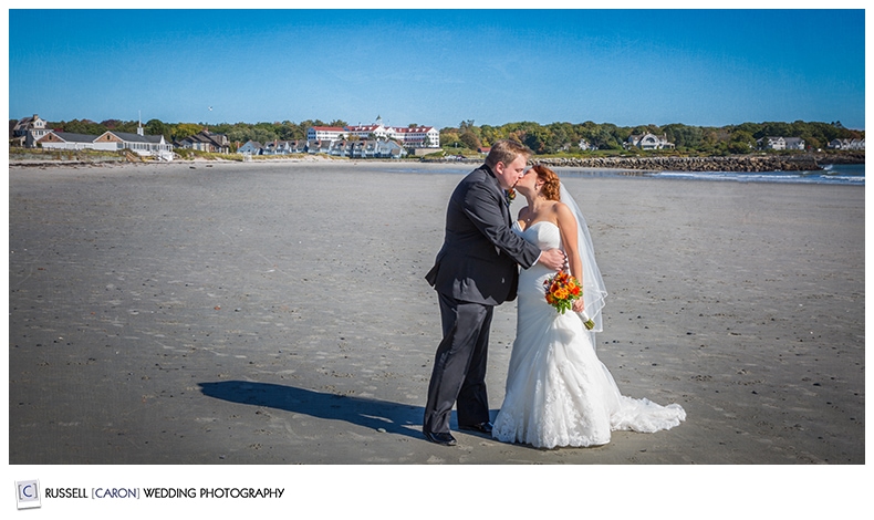bride-and-groom-kissing-on-the-beach