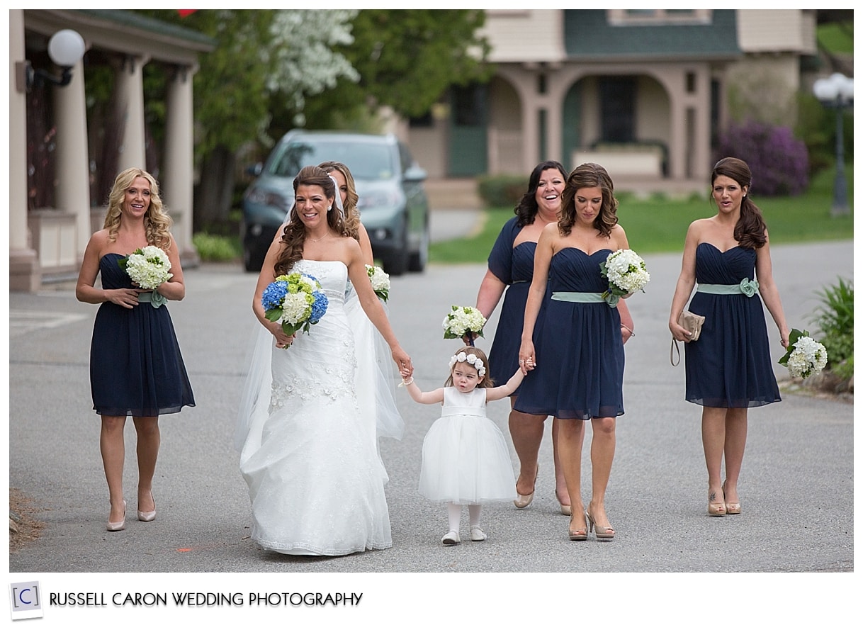 Bride and bridesmaids crossing street