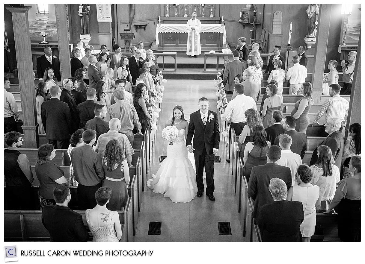 Bride and groom recessing down the aisle