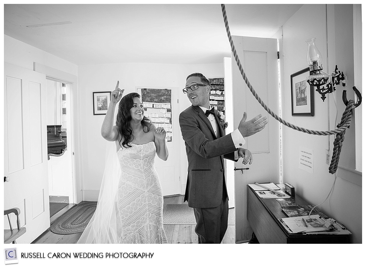 Bride and groom tolling the church bell