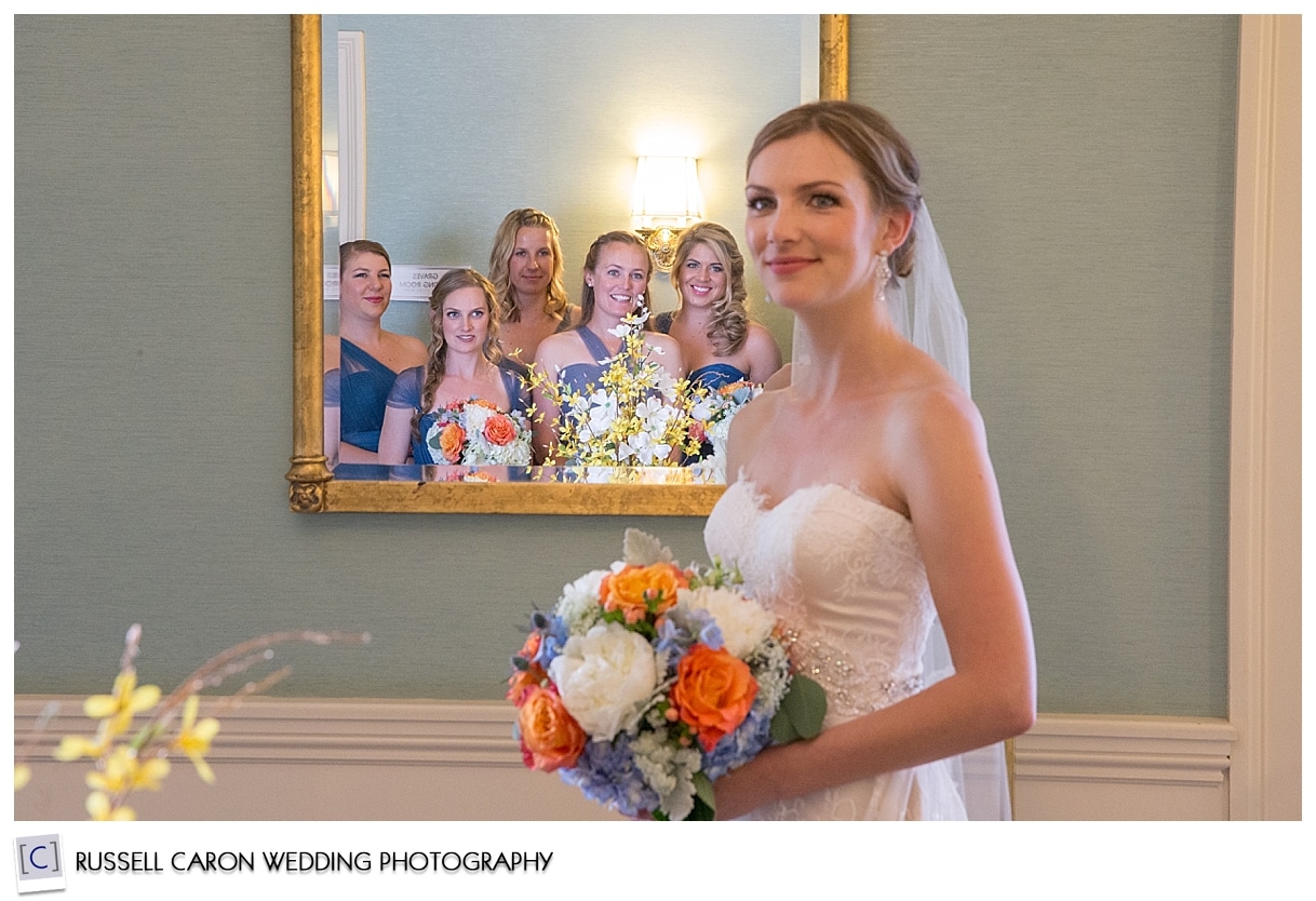 Bride and bridesmaids in mirror