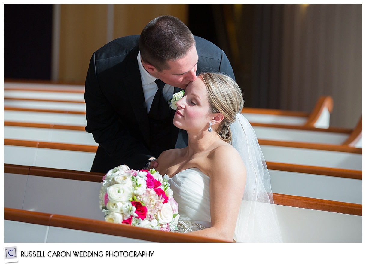 Bride and groom during a quiet moment in church