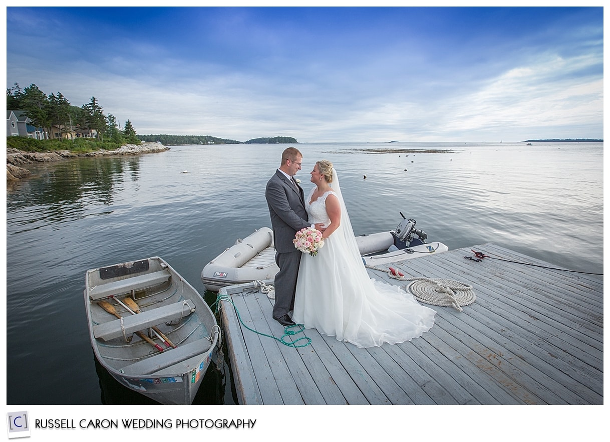 Bride and groom on the dock at Sebasco Harbor Resort, by Sebasco Harbor wedding photographers, Russell Caron Wedding Photography