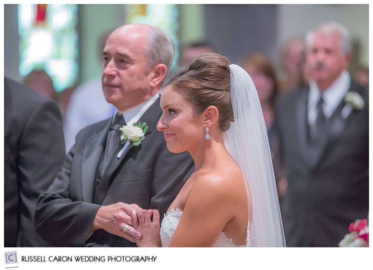 Father and bride at altar