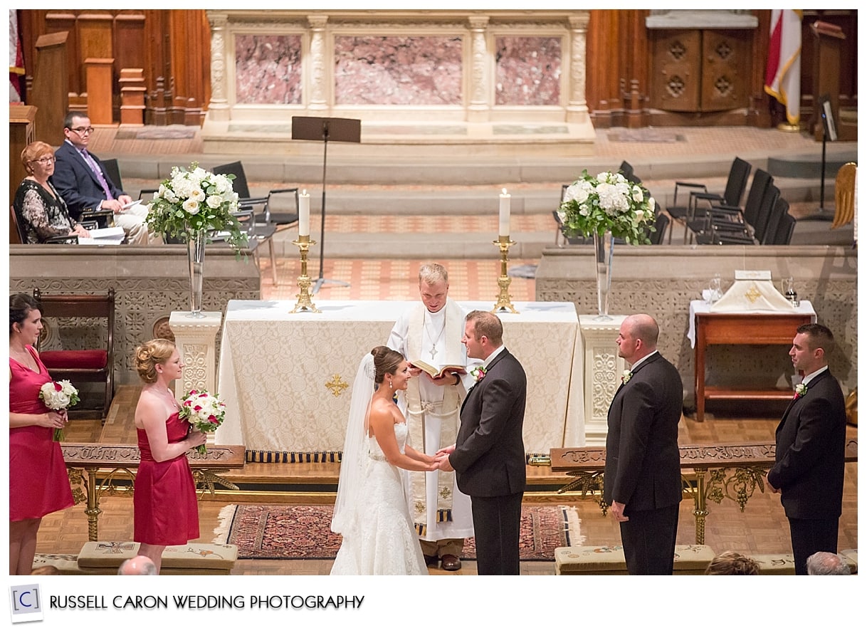 Bridal party at altar of church