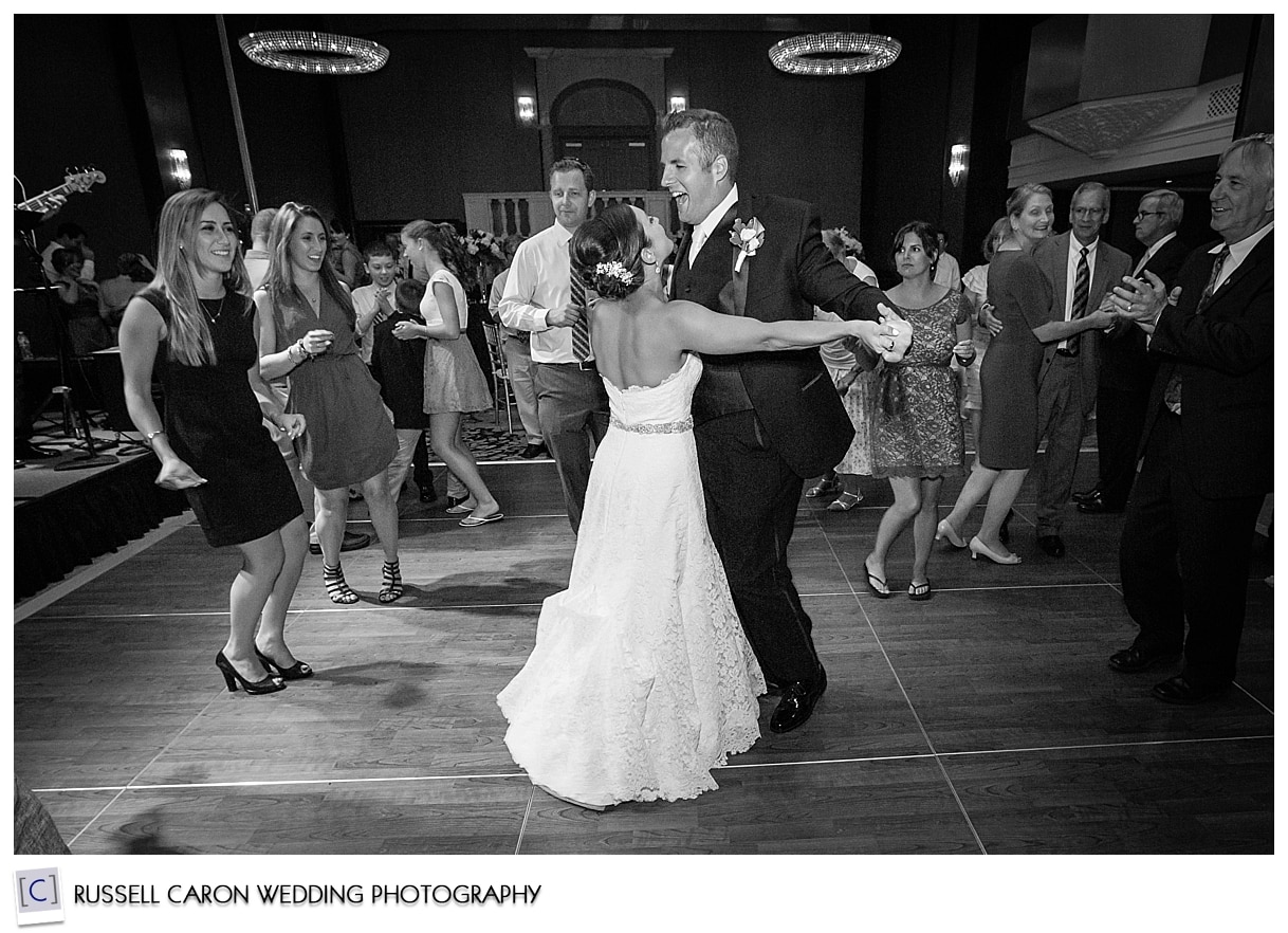 Bride and groom dance at reception