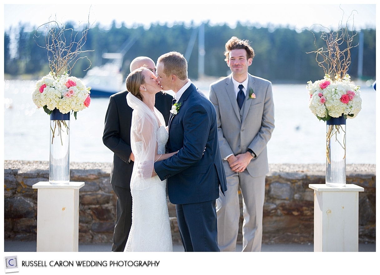 Bride and groom's first kiss photo