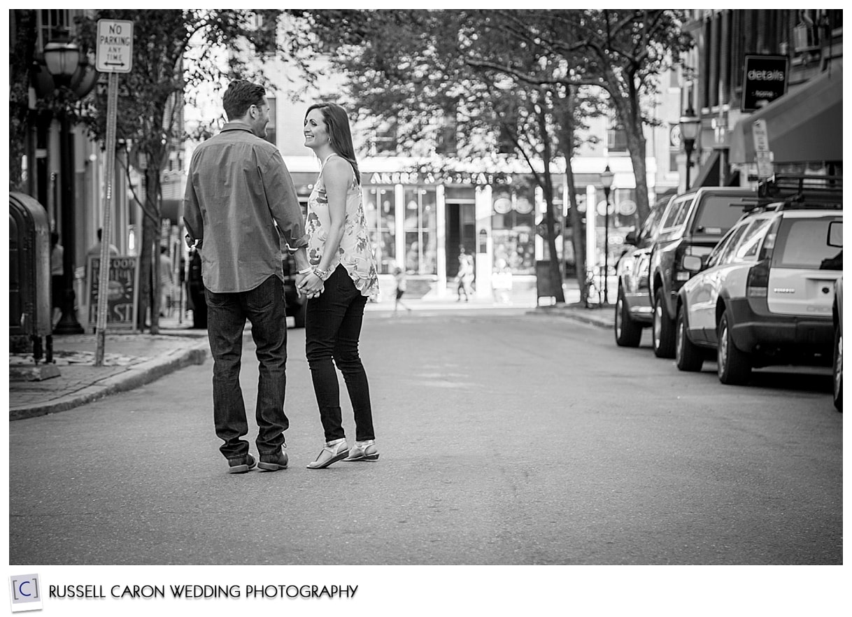 Couple walking down Exchange Street, Portland, Maine