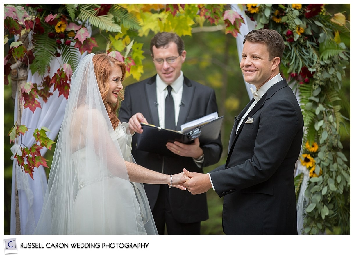 Bride and groom during wedding ceremony, Granite Ridge Estate, Norway, Maine