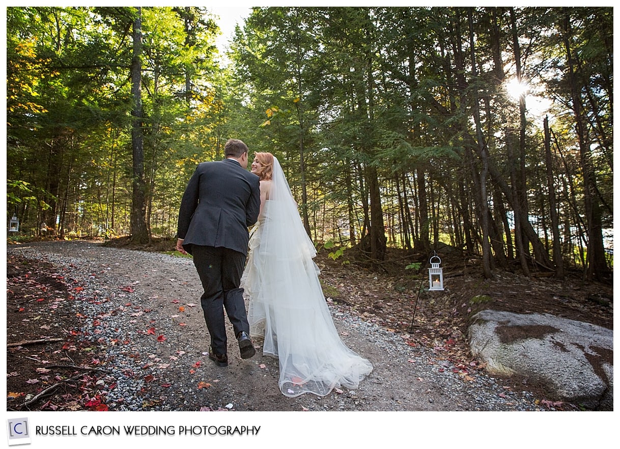 Bride and groom kiss during recessional