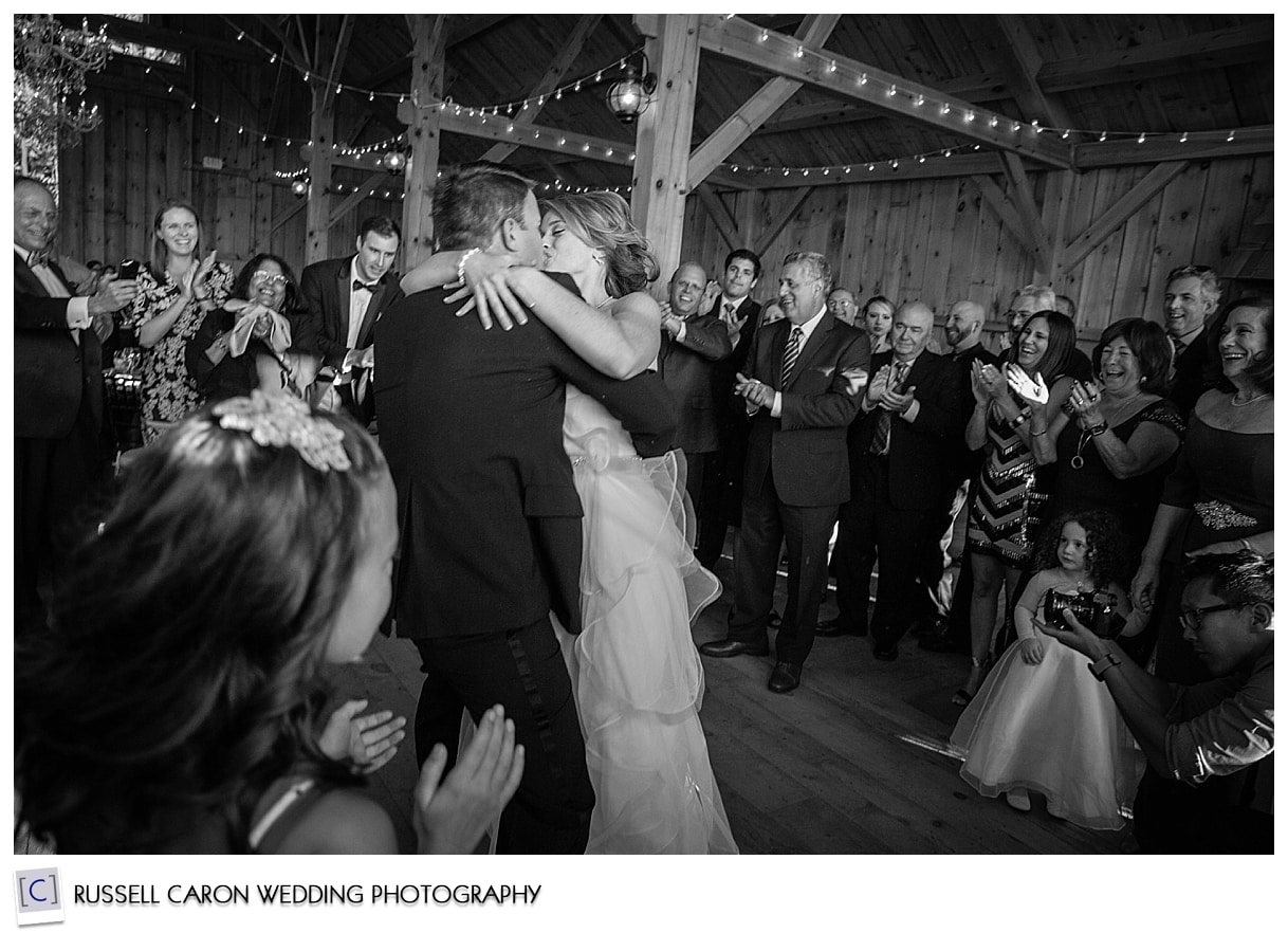 Bride and groom kissing at Granite Ridge wedding reception