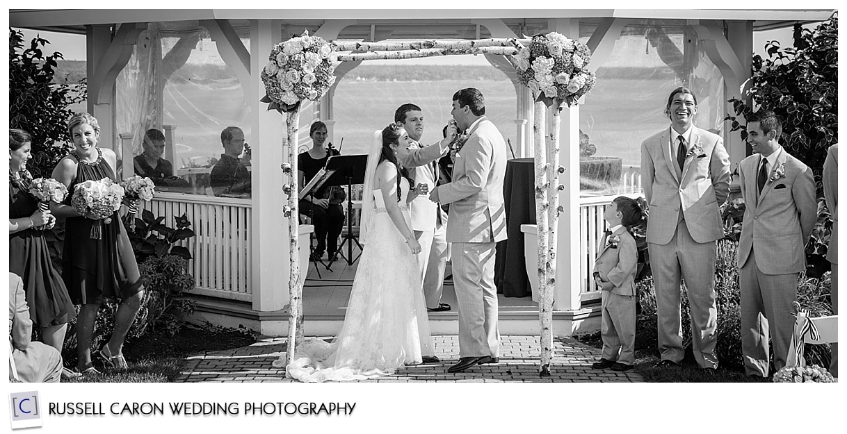 Couple during wedding ceremony at French's Point Maine