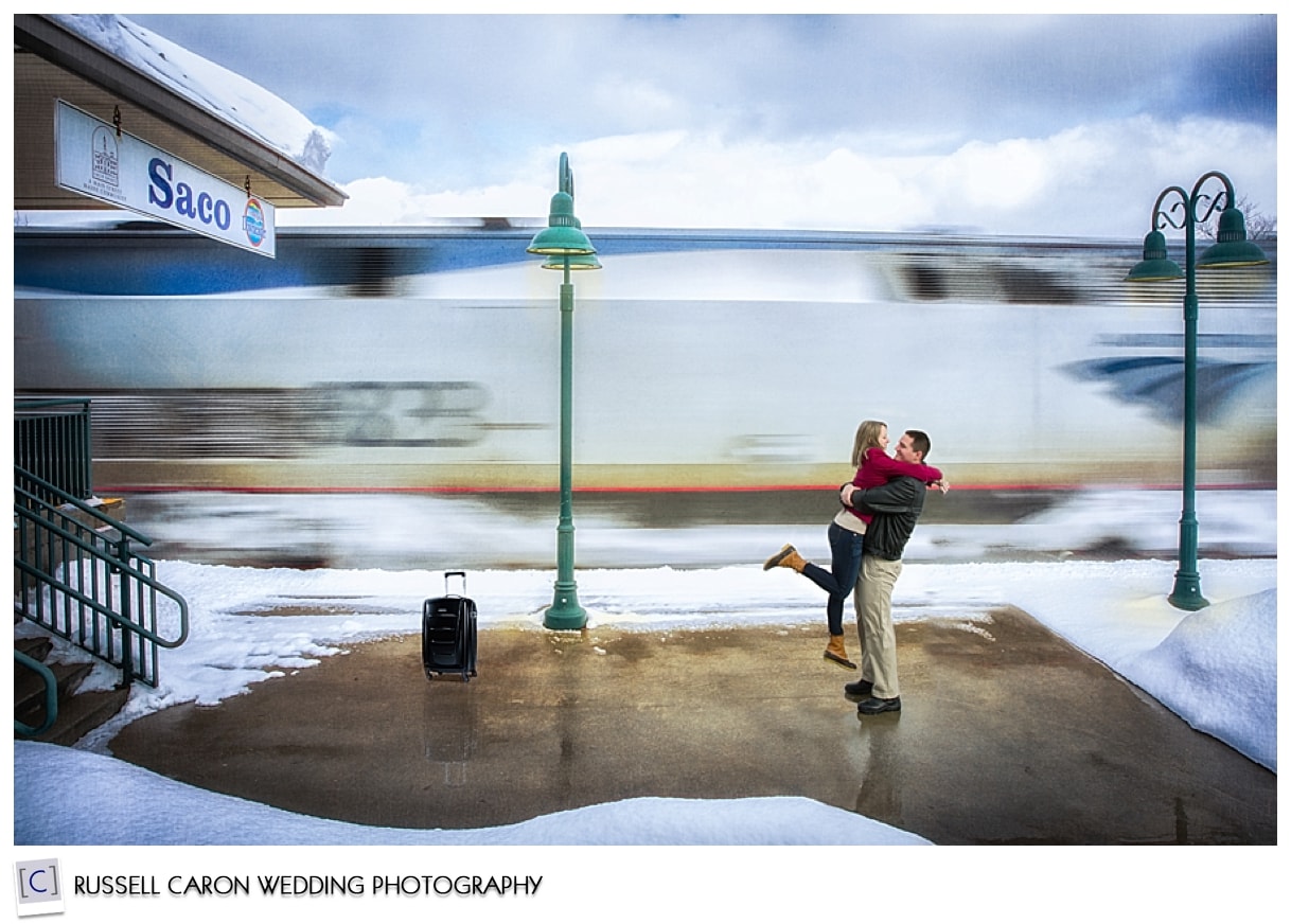 Couple hugging at train station