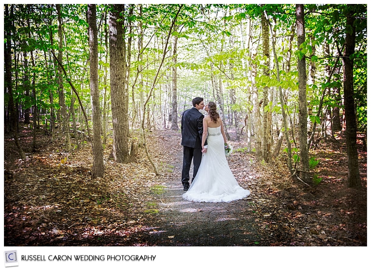 Bride and groom kissing in the woods, Bar Harbor, Maine