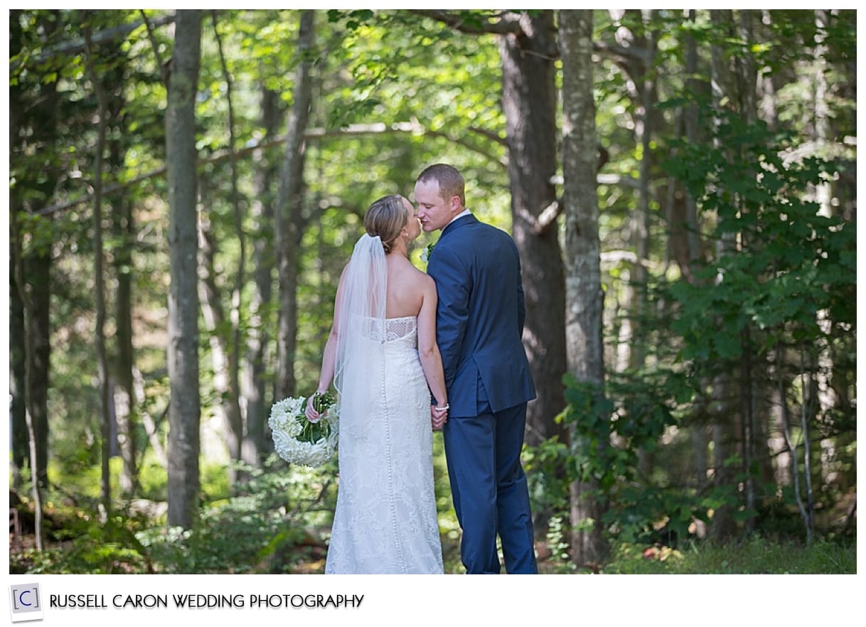 Bride and groom kissing in the woods, Phippsburg, Maine weddings