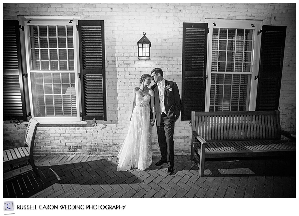 Bride and groom kissing in the dark