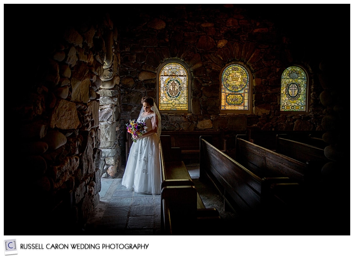 Bride standing in beam of light at St. Ann's Episcopal Church