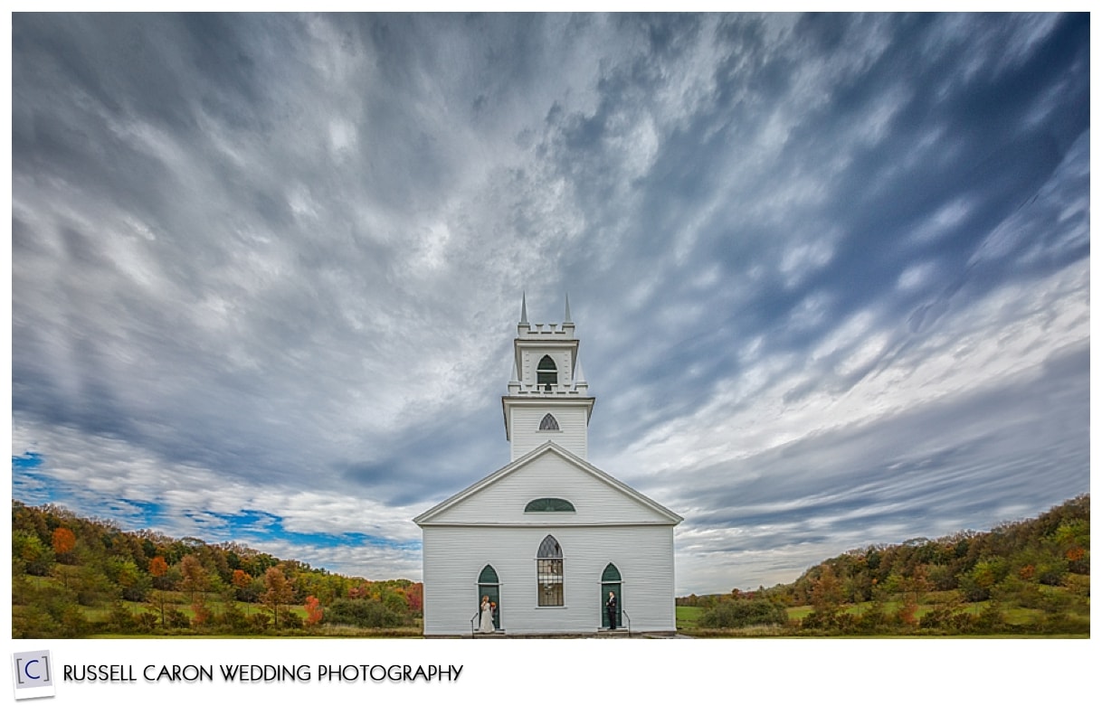 Bride and groom in front of old Norway church, #1, 50 best wedding images of 2015