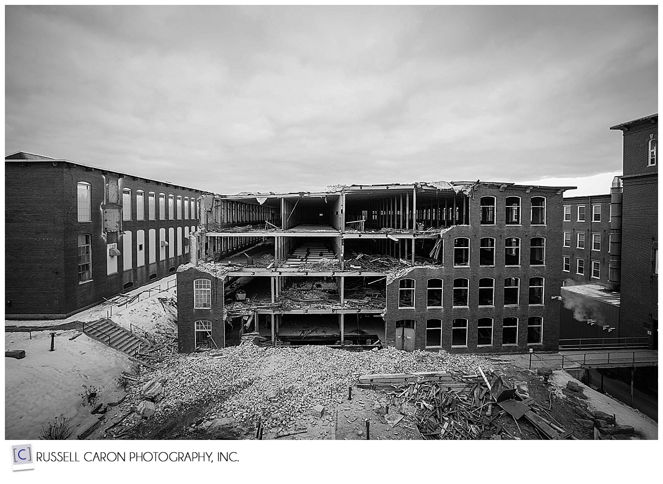 dramatic black and white view of dismantling building 16