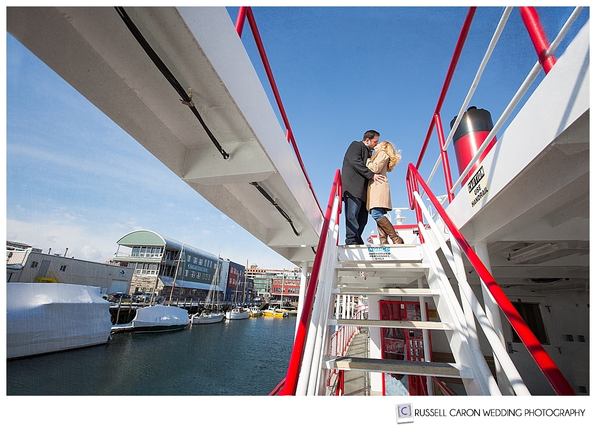 Couple kissing at Casco Bay Lines, Portland Maine engagements