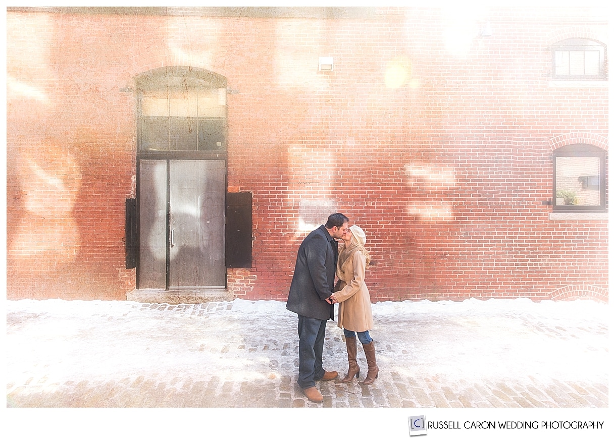 Couple kissing on Wharf Street Portland Maine