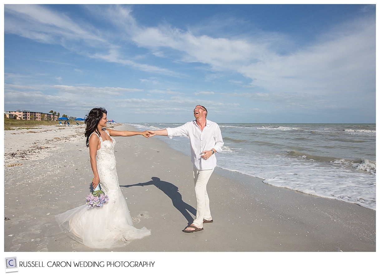 Bride and groom dancing on the beach at Sanibel Island, Florida