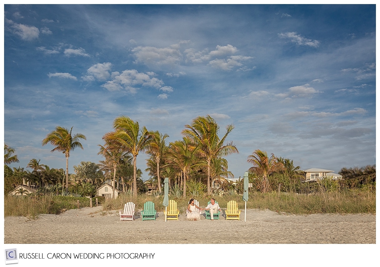 Bride and groom in adirondack chairs, Captiva Island, Florida