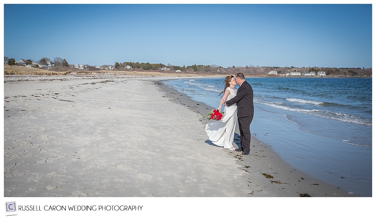 Bride and groom kissing on Crescent Beach, Cape Elizabeth