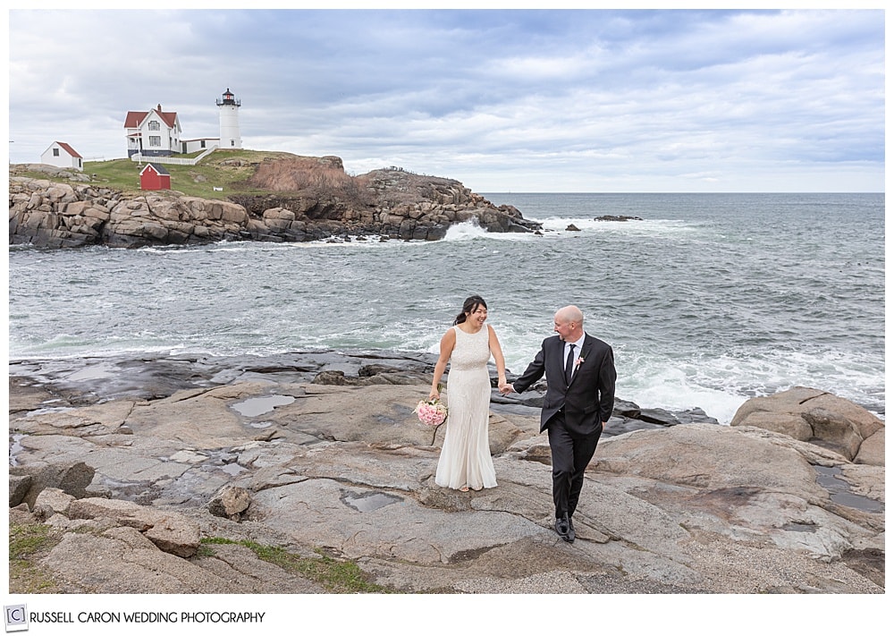 just married couple at nubble light in york maine