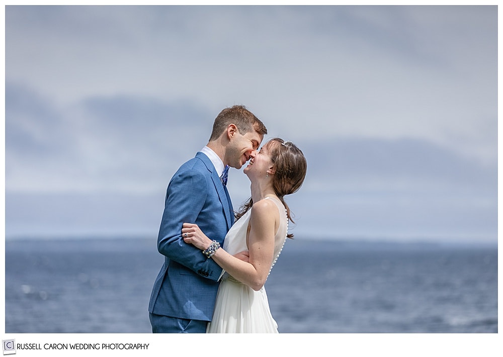 bride and groom, in a captivating kiss, Lincolnville, Maine