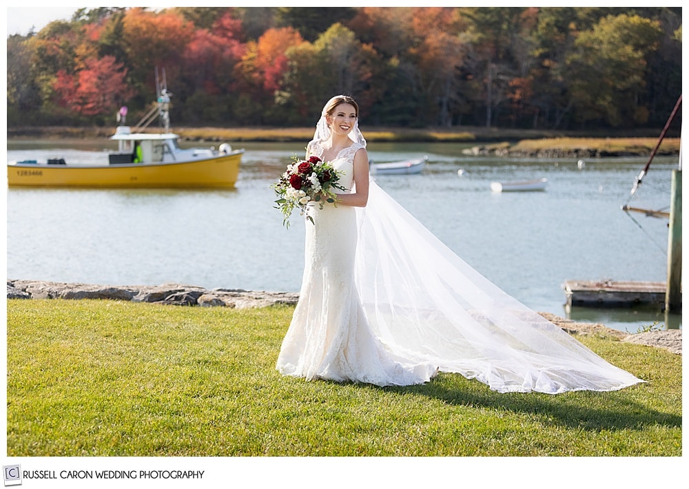 Beautiful bridal portrait of Colby on the banks of the Kennebunk River, at the Nonantum Resort, Kennebunkport, Maine