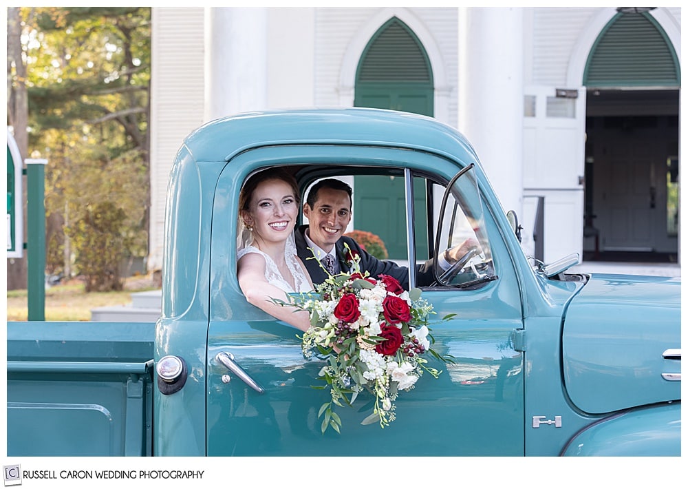 Bride and groom in an antique truck in a Kennebunkport wedding getaway moment, Kennebunkport, Maine