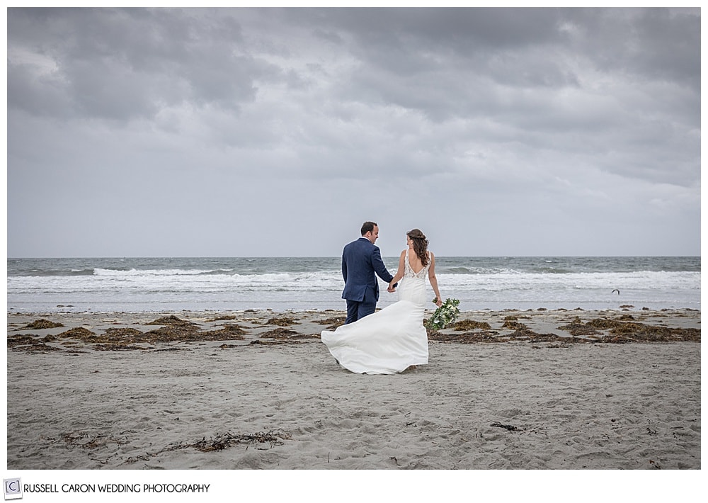 a windswept Maine wedding photo, with a bride and groom at Gooch's Beach, Kennebunk, Maine