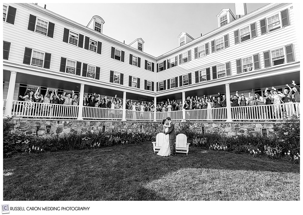 feel the love group wedding photo on the porch of the Colony Hotel, Kennebunkport, Maine 