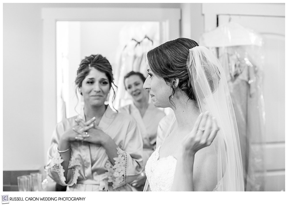 black and white photo of a sweet bride getting ready on her wedding day at the Nonantum Resort, Kennebunkport, Maine