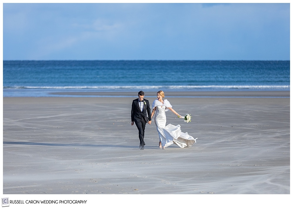 breezy beachy environmental wedding photo of a bride and groom on Ogunquit Beach, Ogunquit, Maine