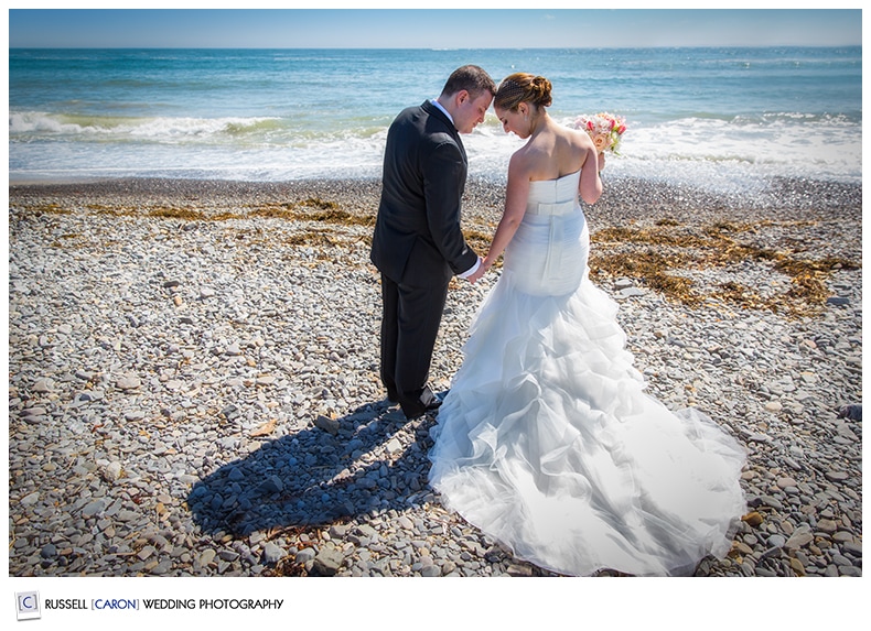 Bride and groom on the beach in Kennebunkport Maine wedding photographers