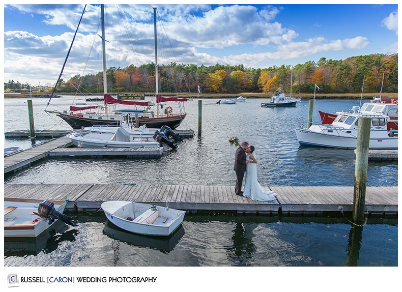 Bride and groom on the dock at the Nonantum Resort, Kennebunkport Maine