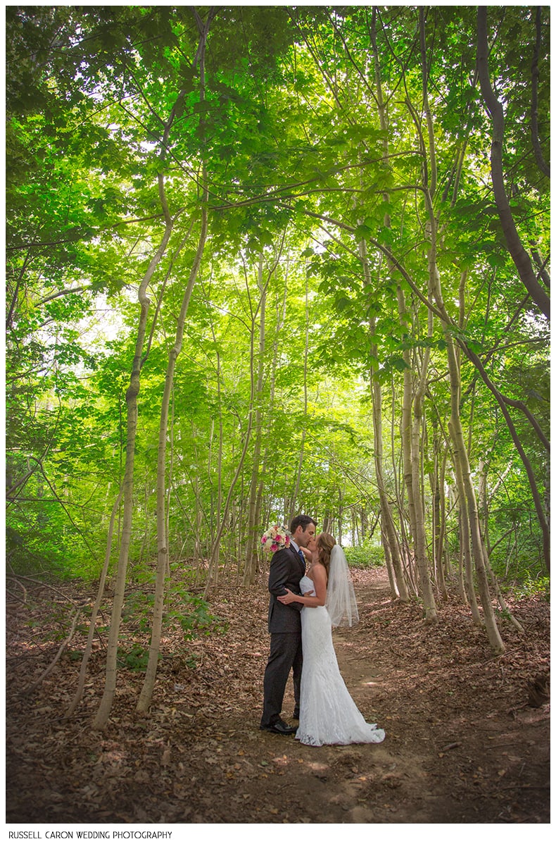 Bride and groom in the middle of the woods