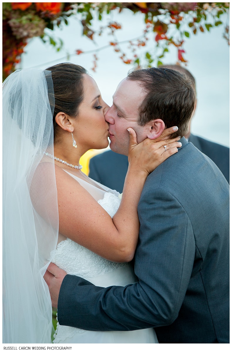 Wedding day first kiss photo