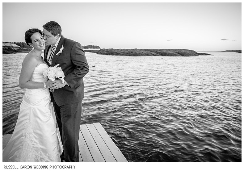 Bride and groom on the Sebasco Harbor dock