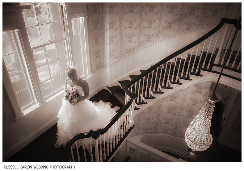 Bride on the stairs at Glen Magna Farms Manor House
