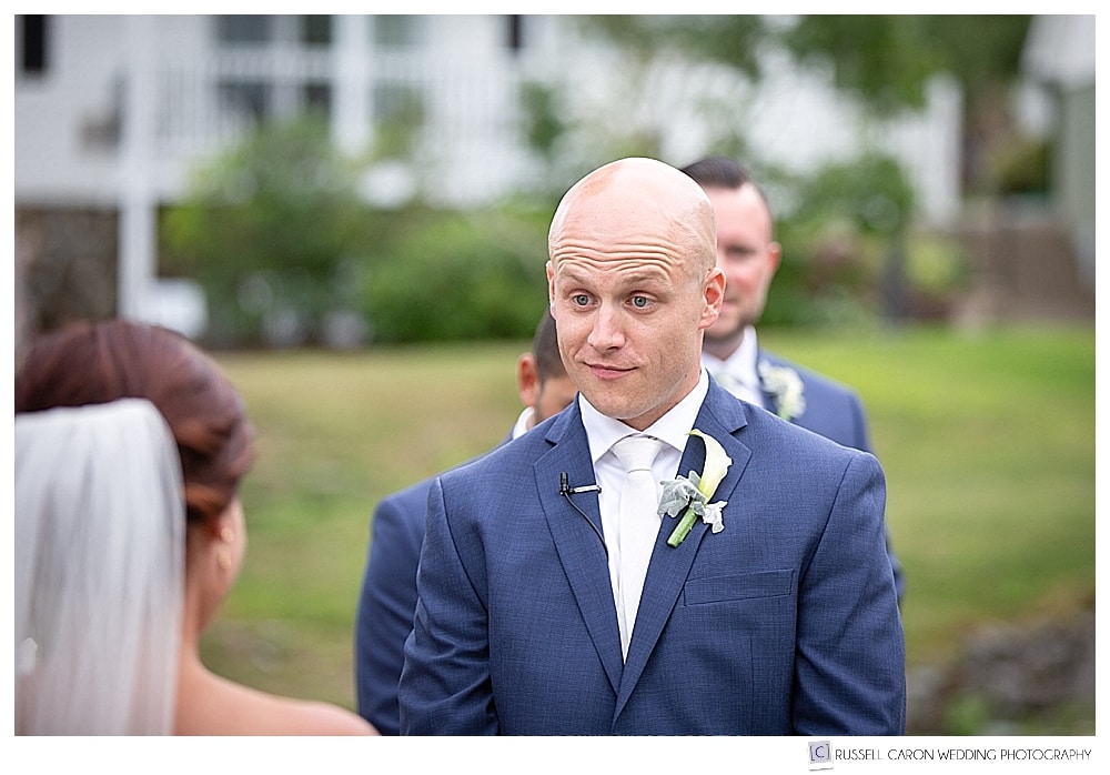 Groom looking at bride during outdoor wedding ceremony at the Atlantic Oceanside Resort, Bar Harbor, Maine