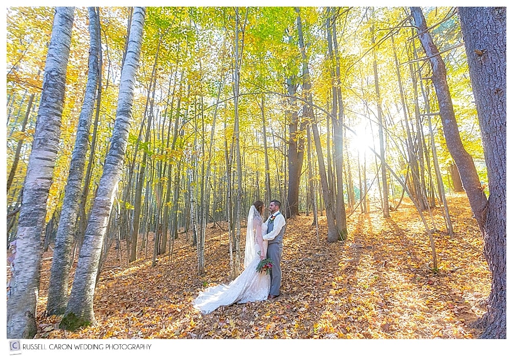 bride and groom in the autumn woods 