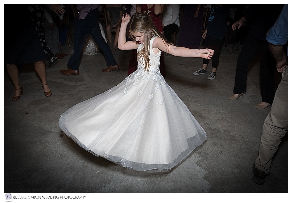 flower girl twirling on the dance floor during a Barn at Silver Oaks Estate wedding reception