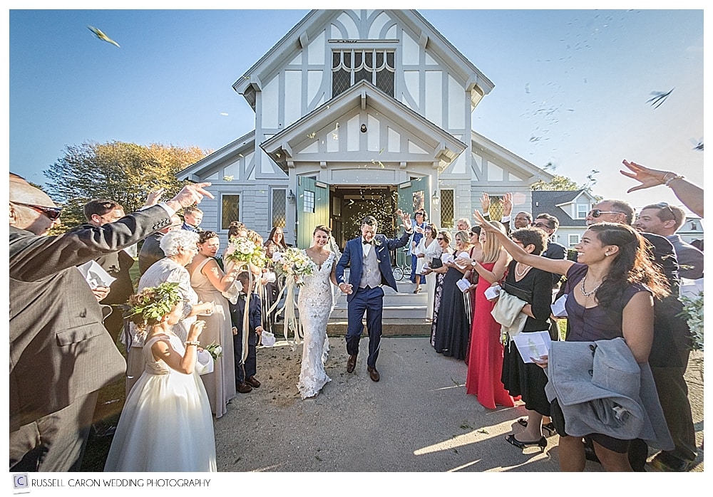 Number 2 in our top Maine wedding photos, Emily and John as they exit their wedding ceremony on Peaks Island, Maine