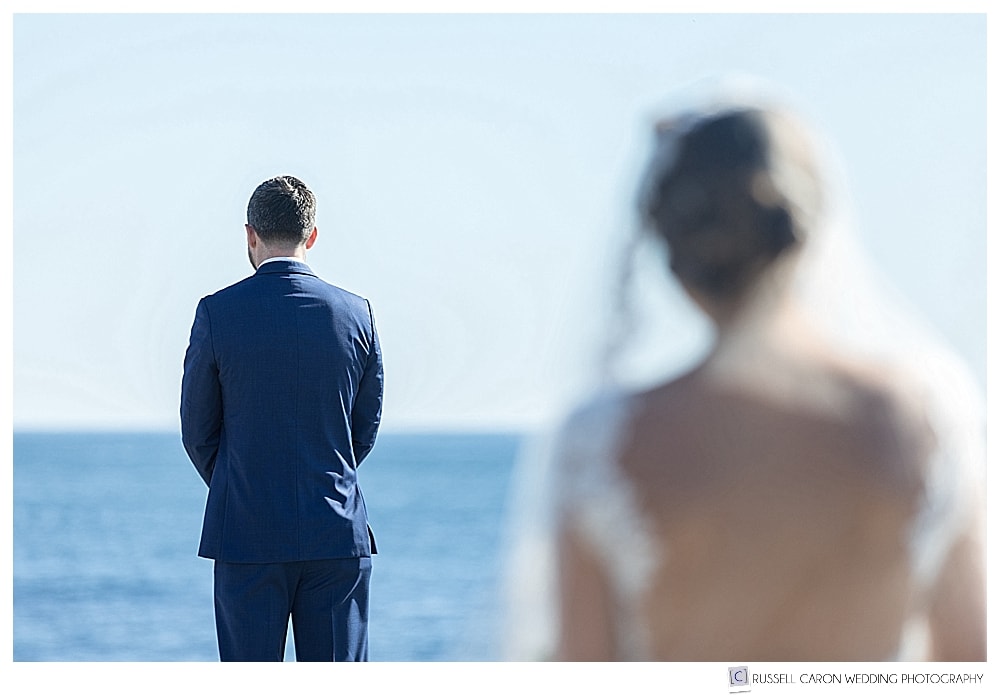 Groom with his back turned during wedding day first look