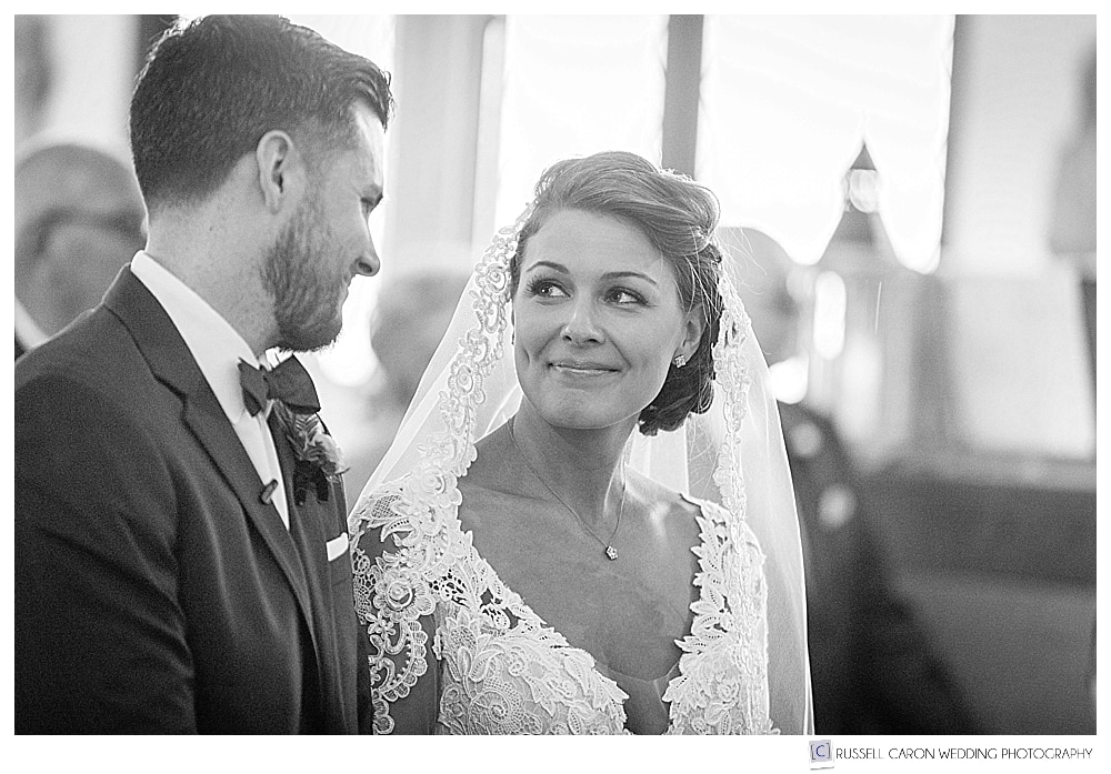 Bride and groom looking at each other during their Peaks Island Maine wedding ceremony