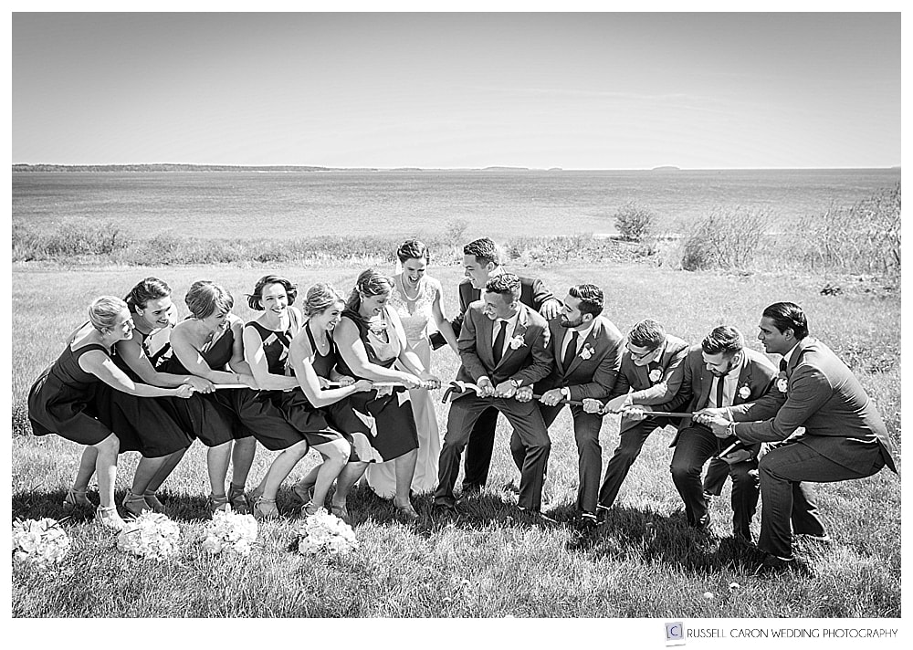 bride and groom help bridal party with tug of war. A Maine Wedding Photography Honorable Mention 2017